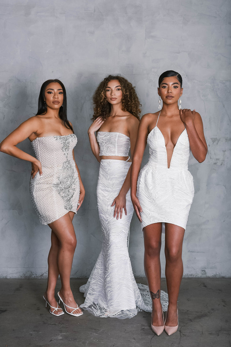 Three brides wearing beautiful unconventional wedding reception dresses, designed exclusively at Lawrencia Bridal