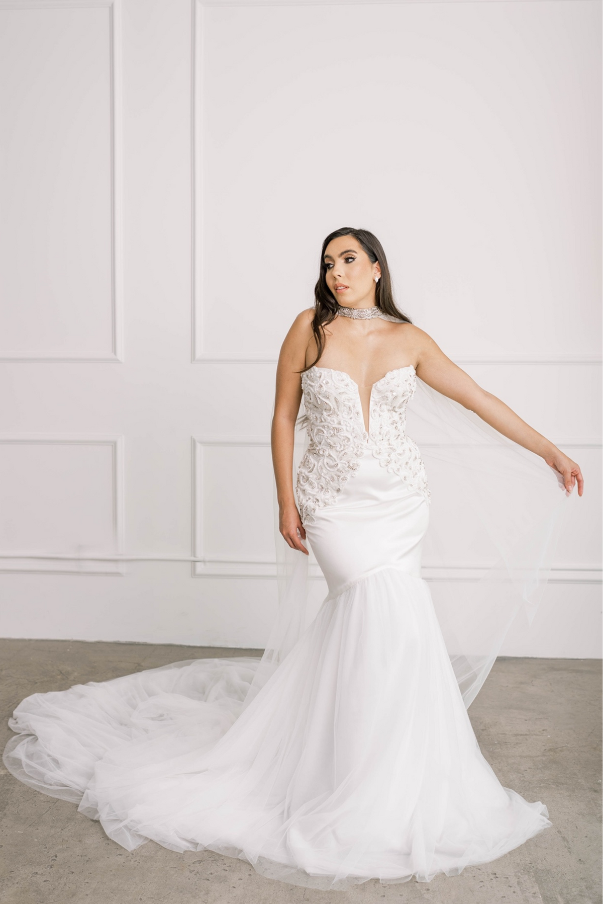 Bride displaying Lawrencia Bridal Couture Simone tulle netted wedding cape with Swarovski crystal choker