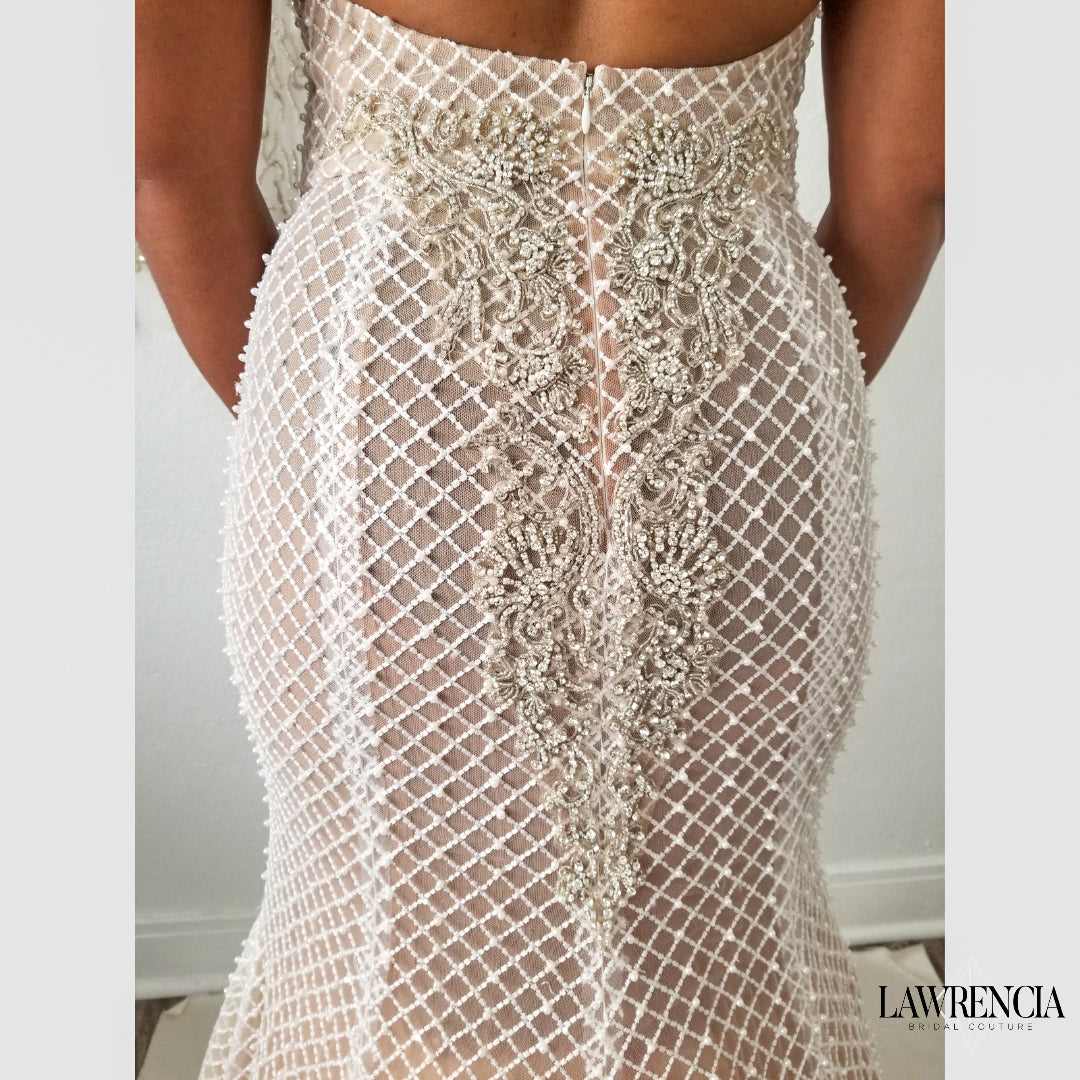 Detailed view of intricate beading and design of the "Naked" wedding dress