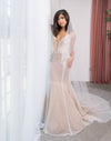 Fashion forward wedding dress with plunging V-front neckline and criss-cross spaghetti straps