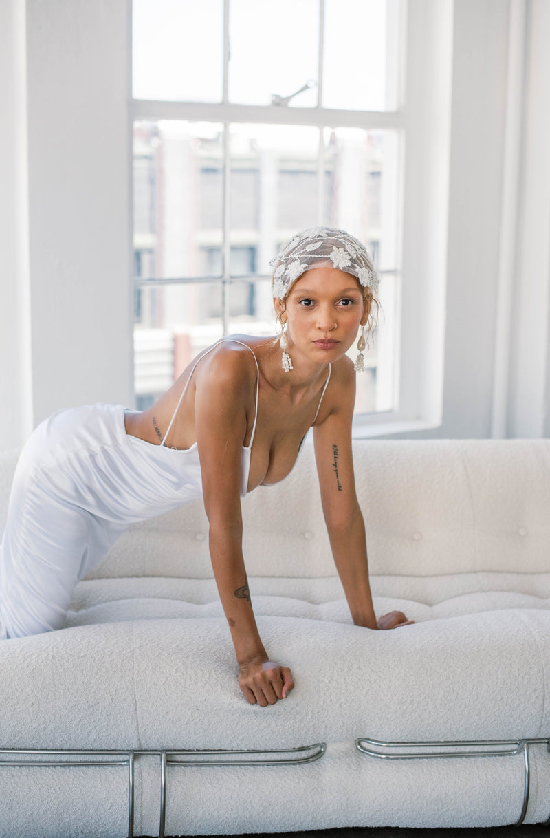 Bride in glam wedding dress with hand embroidered and beaded lace bridal headpiece