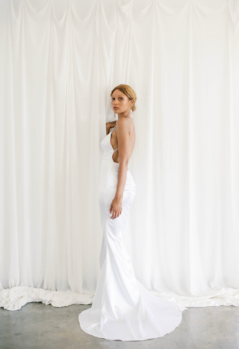 Lawrencia Bridal Couture Hollywood Sexy Low Open Back Wedding Dress for the Chic Modern Bride Satin Mermaid Slip Wedding Gown with Plunging Neckline Available at Our Los Angeles Showroom Hollywood Glamour Bridal Gown Wedding Reception Dress