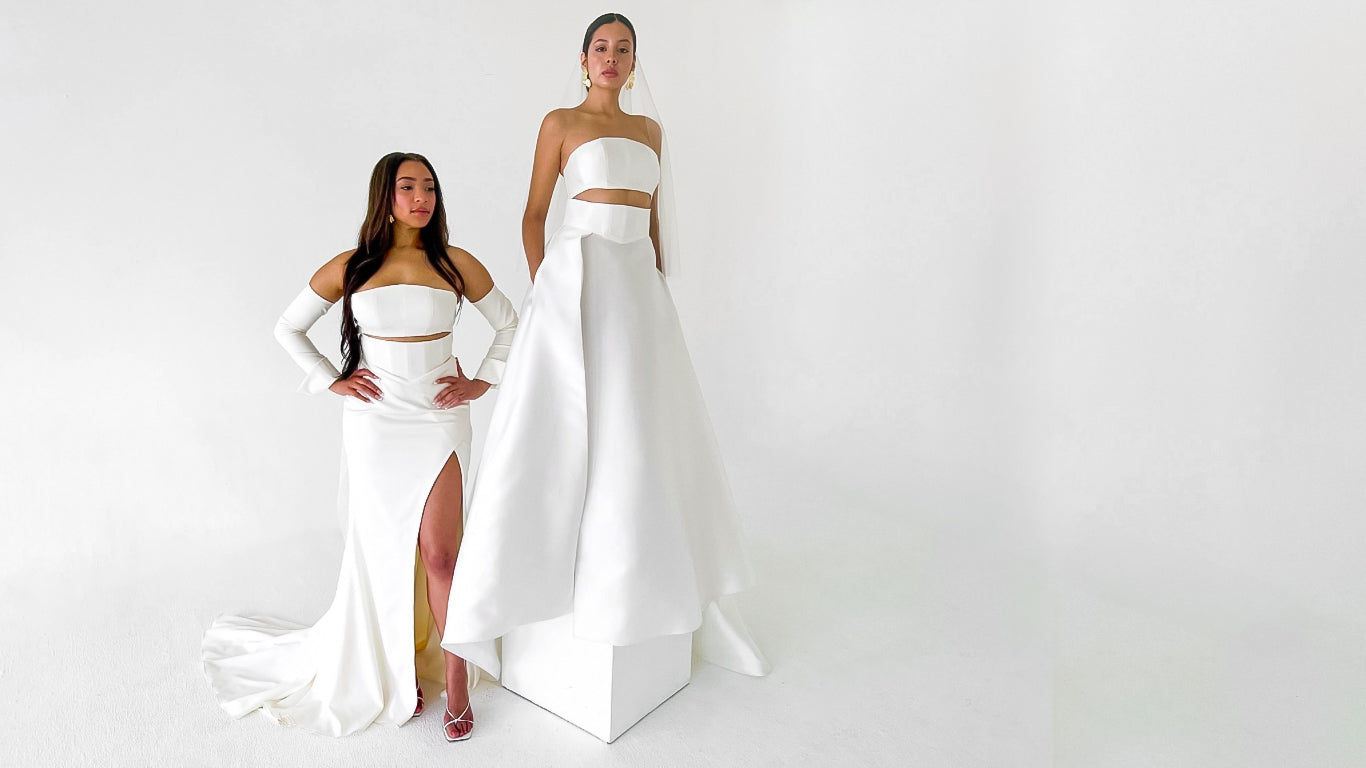 Two brides wear modern chic wedding dresses from the Lawrencia Bridal Couture Modern Matrimony Bridal Collection