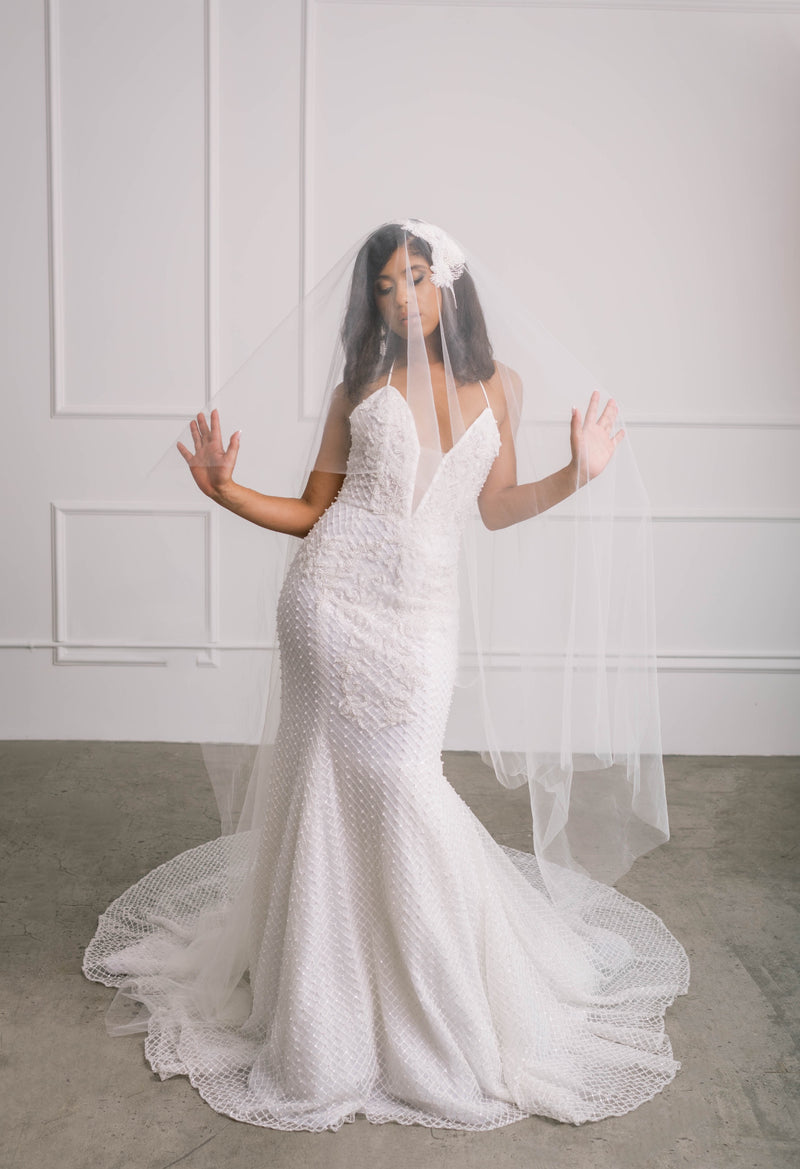 Lawrencia Bridal Couture Ivory Jiselle Luxury Pearl Beaded Mermaid Wedding Dress with Plunging Neckline Available at Our Los Angeles Showroom Hollywood Glamour Bridal Gown