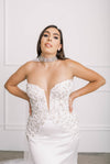 Strapless wedding gown with plunging neckline and beading on the bodice
