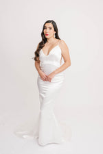 Romantic bride wearing sleek fit and flare satin mermaid wedding dress