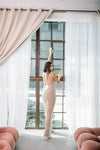 Unique nude wedding jumpsuit with a low back, power mesh lining & steel boning