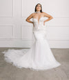 Bride in the wedding cape, with Swarovski crystals, flowing back panels and a soft off-white English tulle netting