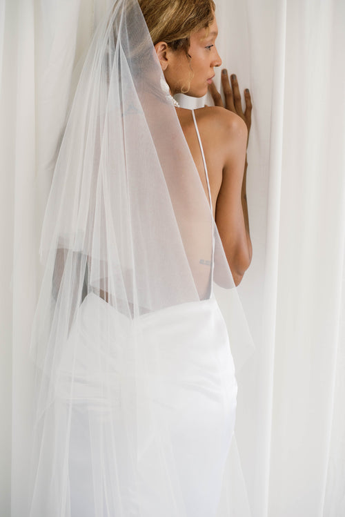 Delicate and elegant ivory cathedral veil with silver comb