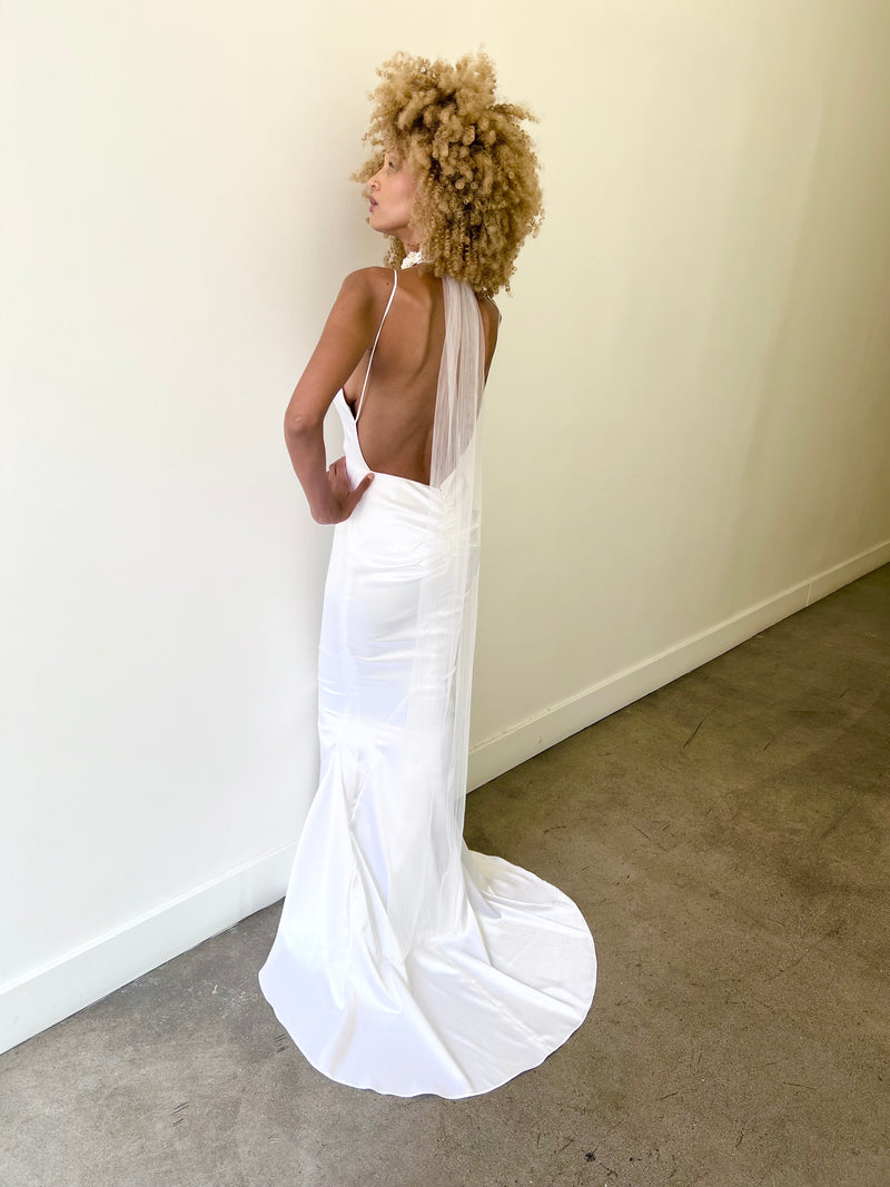Mermaid fit and flare wedding dress with short train and off-white satin